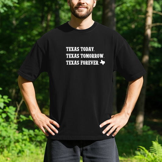 person standing outdoors wearing a black t-shirt with white text that reads Texas Today. Texas Tomorrow. Texas Forever. and a small outline of the state of Texas. 