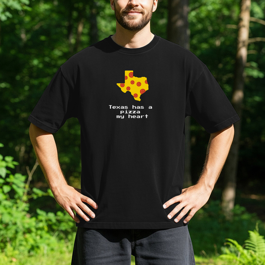 person standing outdoors wearing a black t-shirt with a graphic of the state of Texas designed like a slice of pizza and the text, Texas has a Pizza my heart.